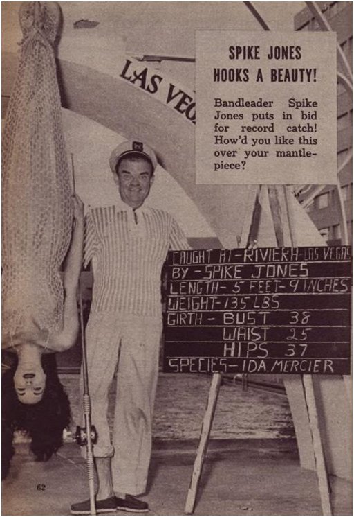 Spike Jones posing with Ida Mercier who is dangling upside down in a fish costume, or possibly she's a mermaid